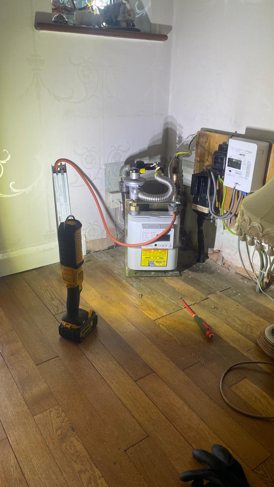 Gas meter with testing equipment during gas line pressure test