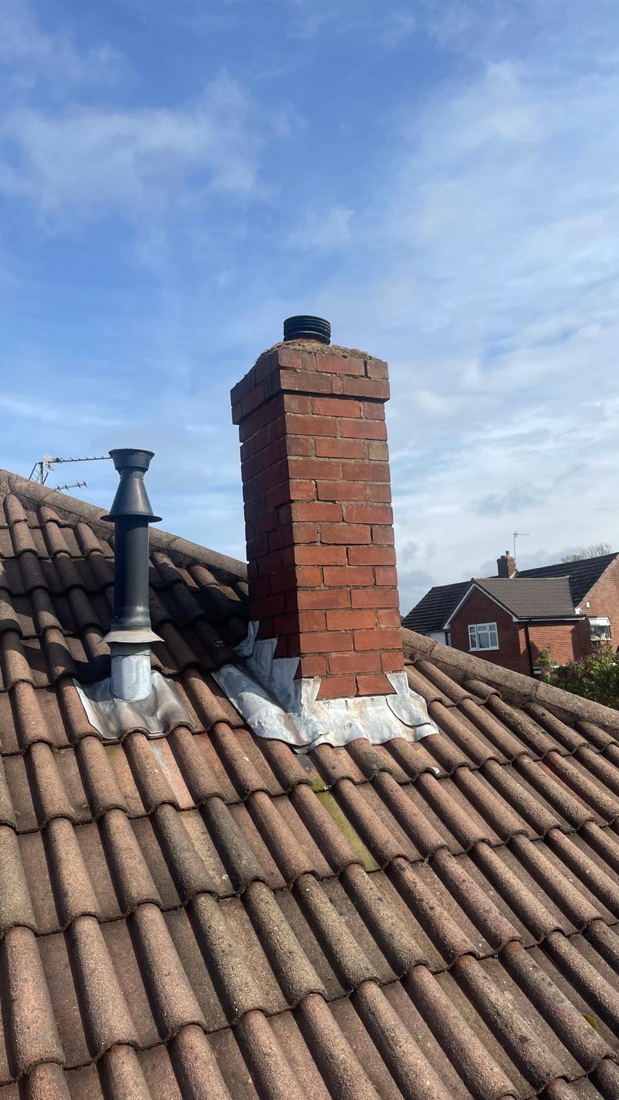 Chimney and flue terminal on the roof of the Wednesbury property