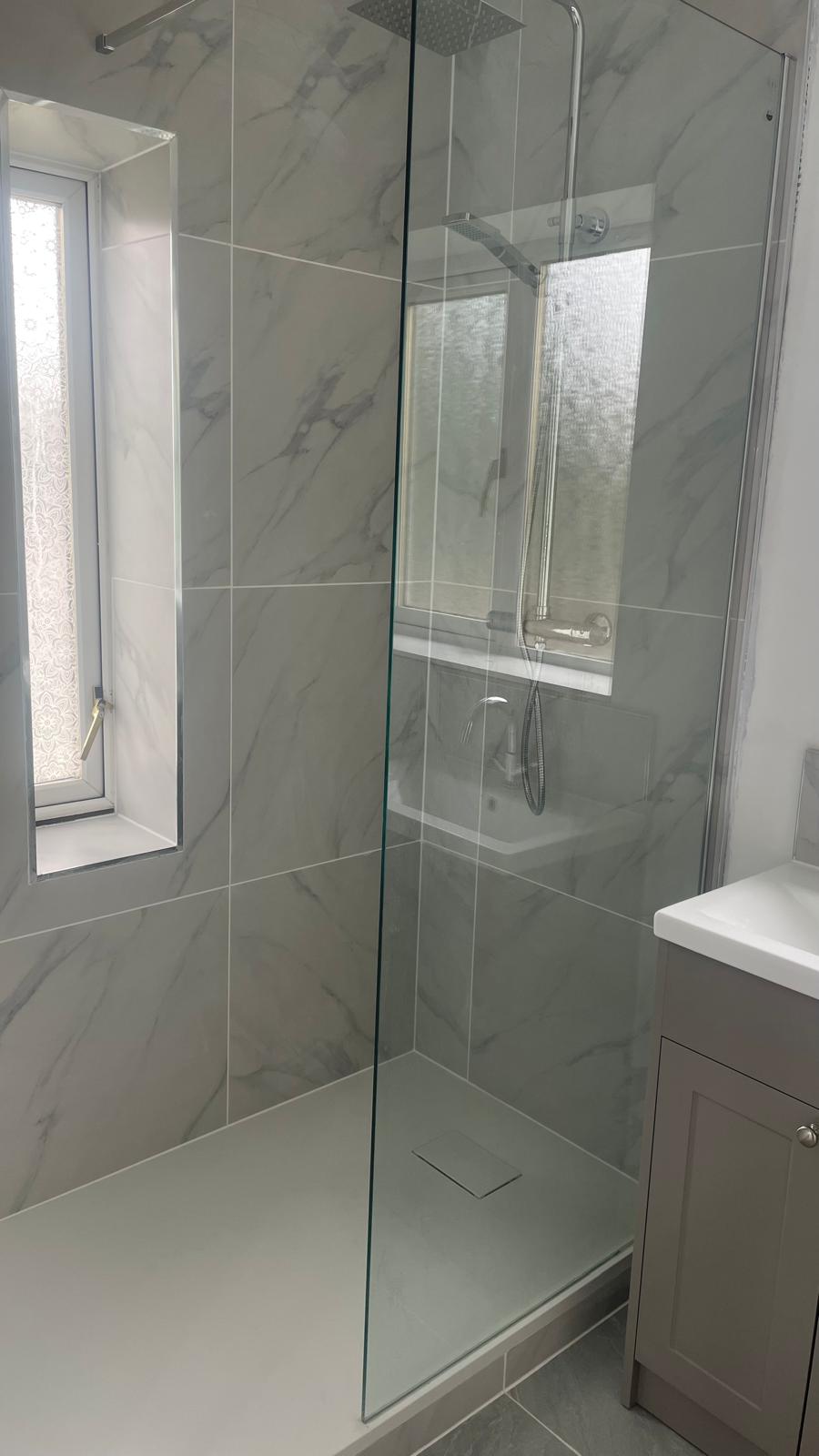 New shower with glass panel and wall tiling in Walsall bathroom