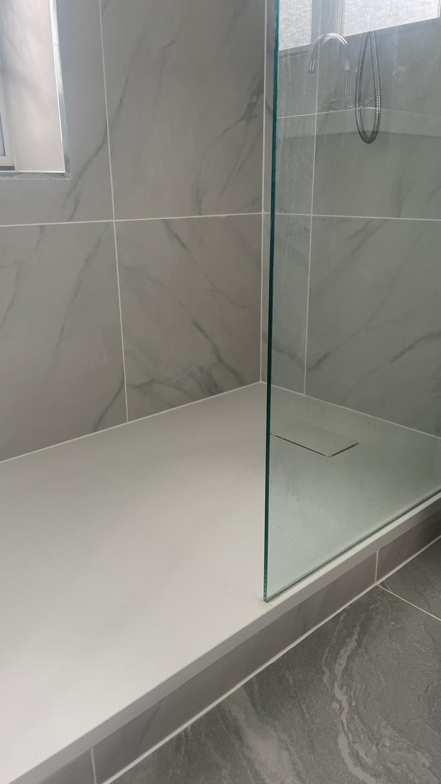 Shower tray and floor tiling detail in Walsall bathroom renovation