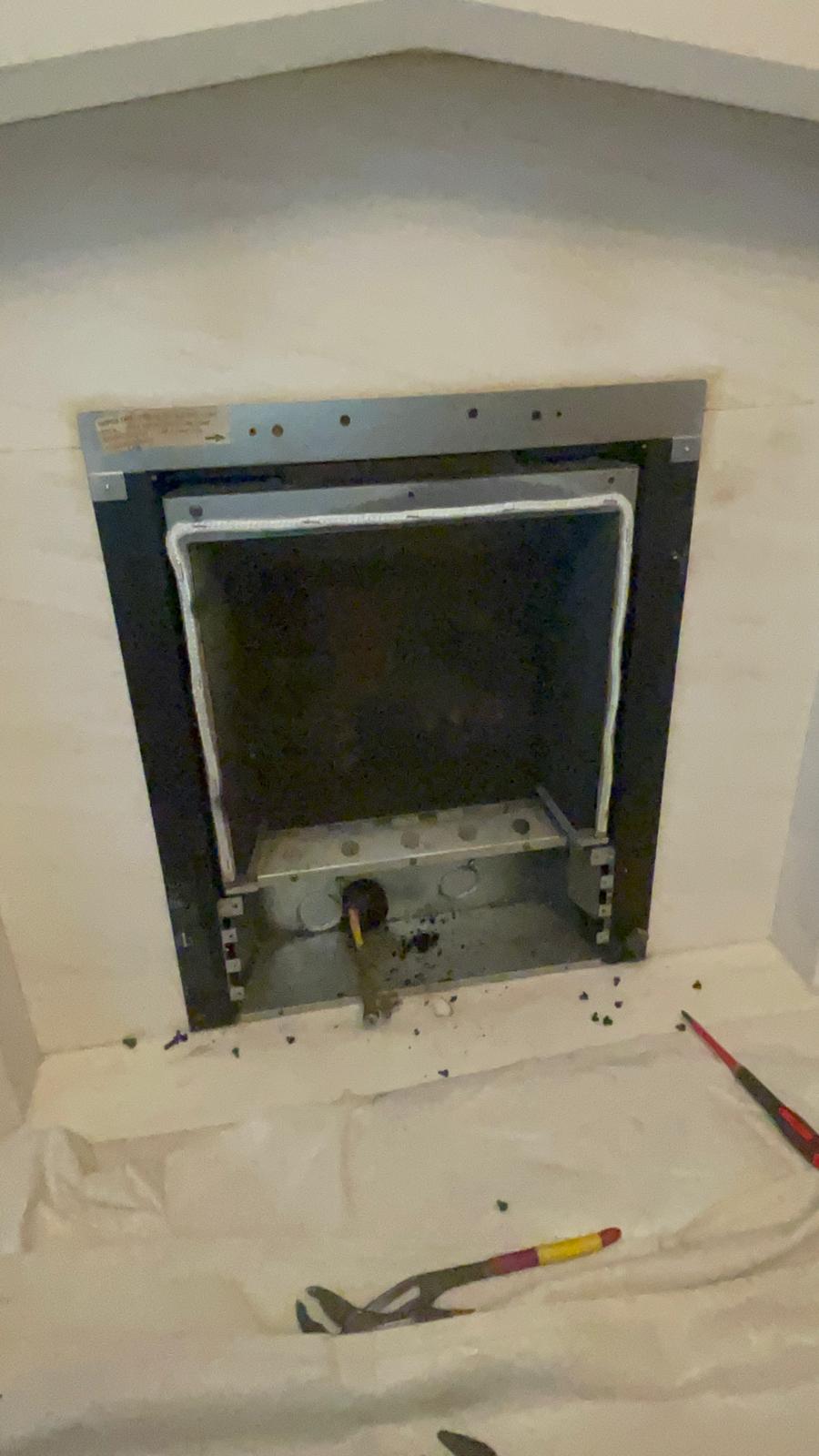 Empty fireplace in West Bromwich with old gas fire removed