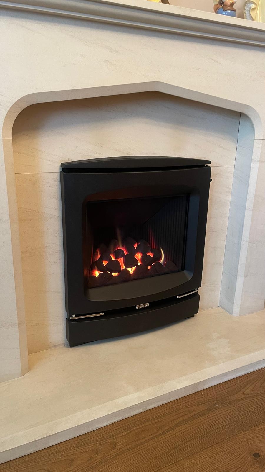 Close-up of new decorative gas fire lit in West Bromwich fireplace