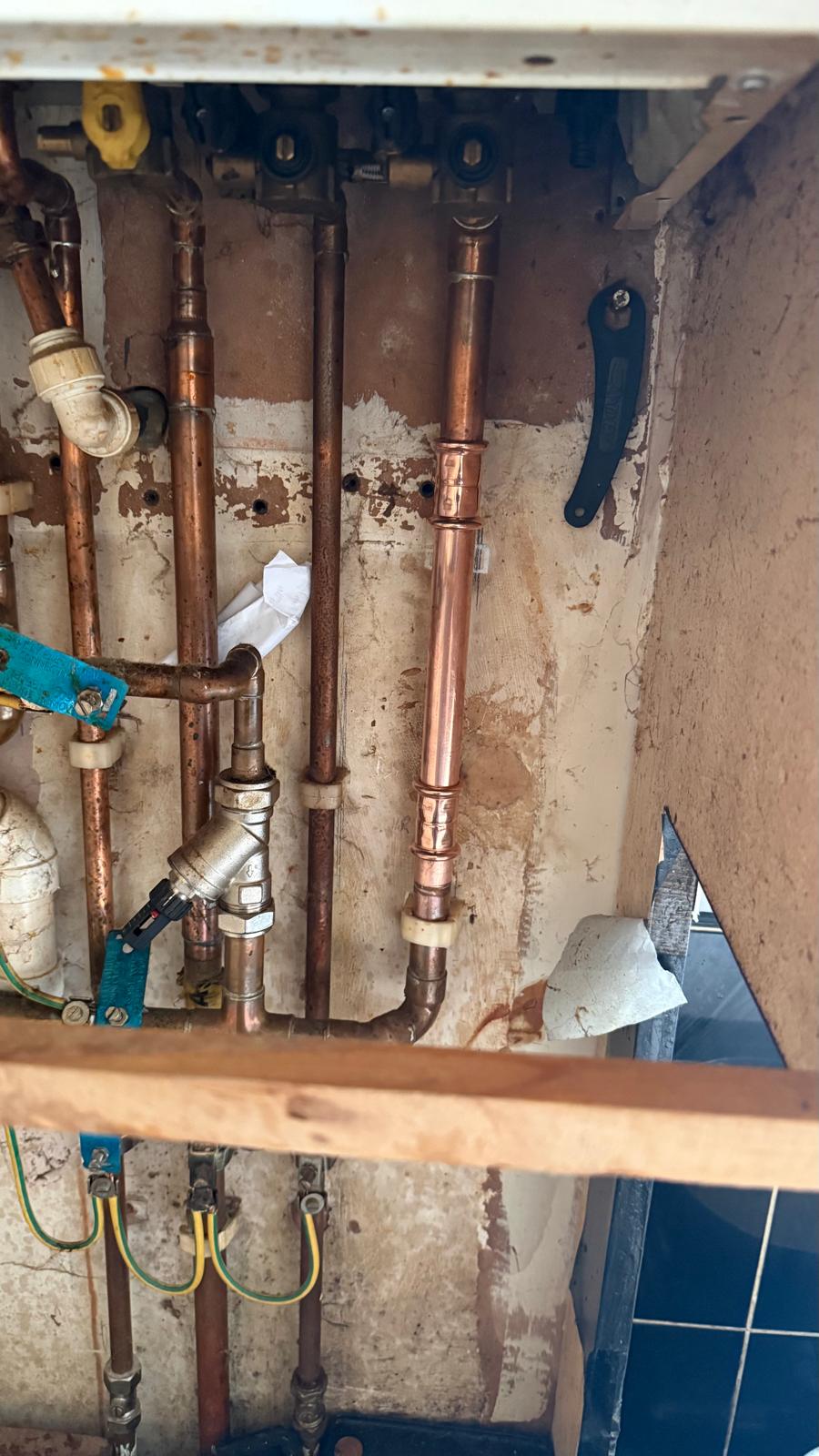 Copper boiler pipework exposed during leak repair in Bearwood Birmingham