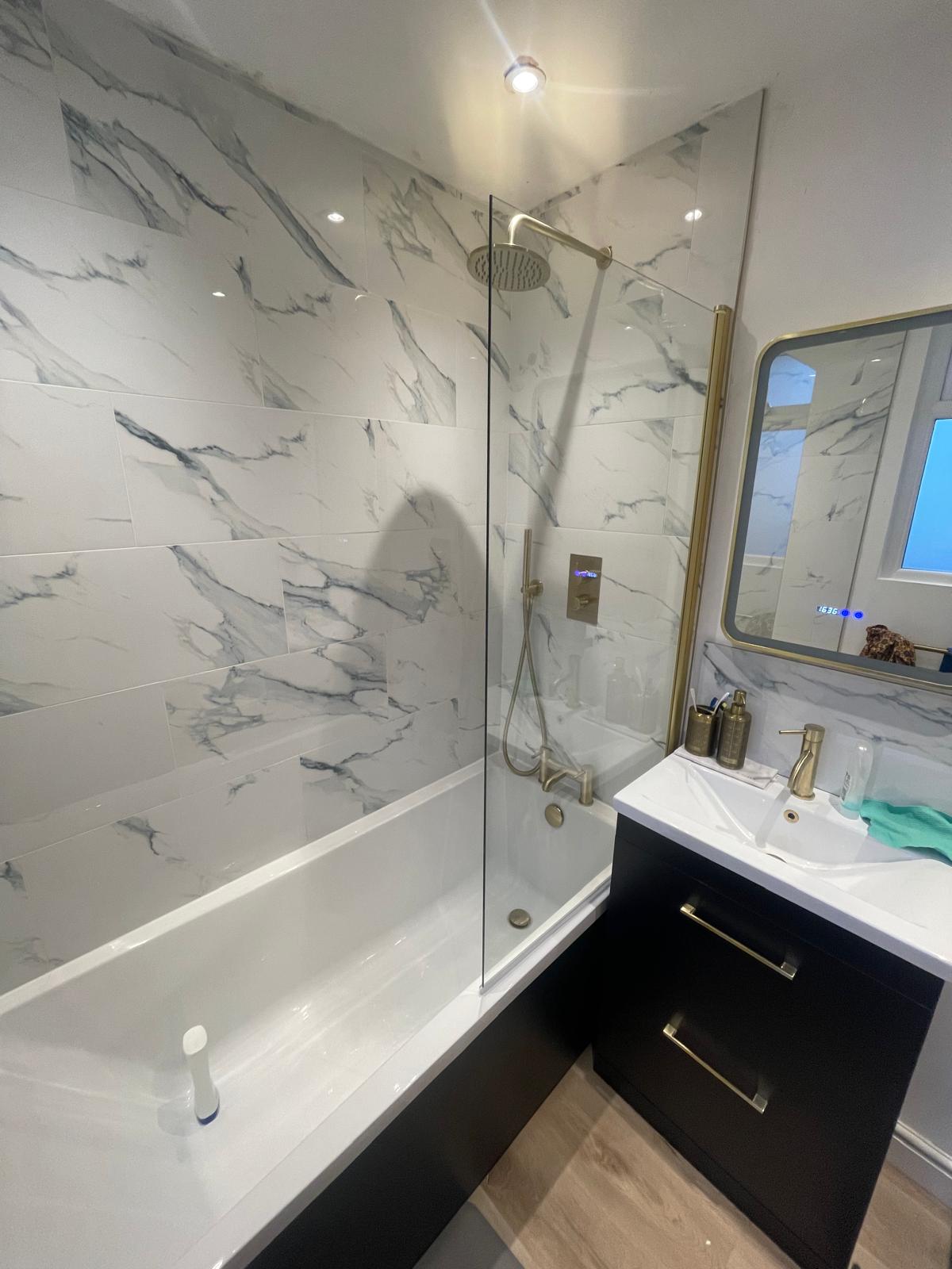 LED mirror with gold frame and vanity sink unit