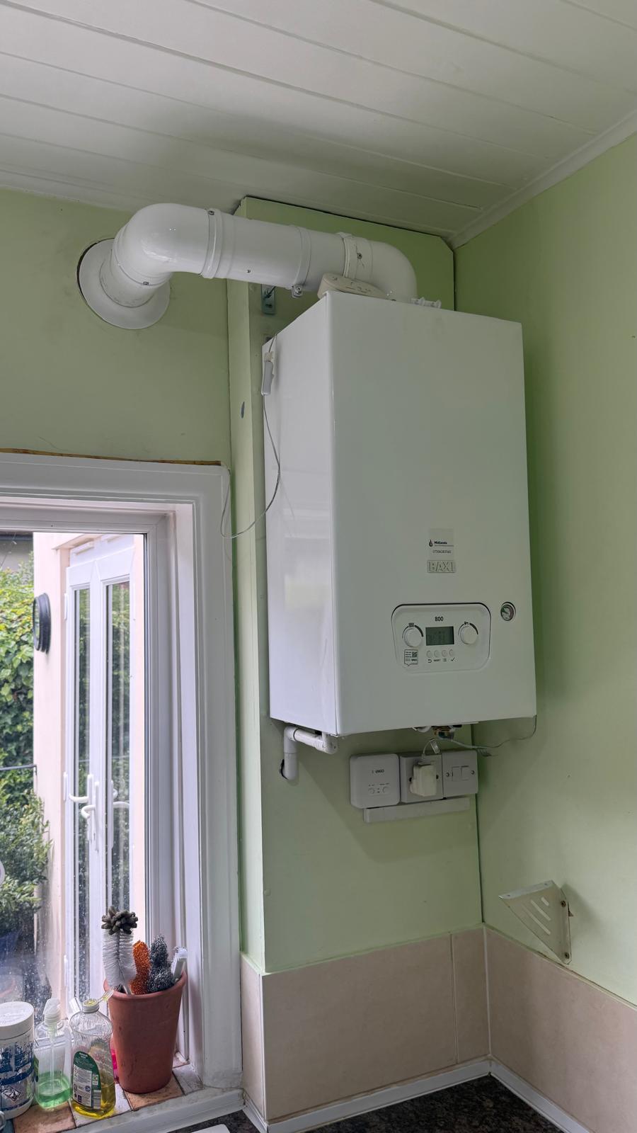 Completed boiler installation with tidy pipework